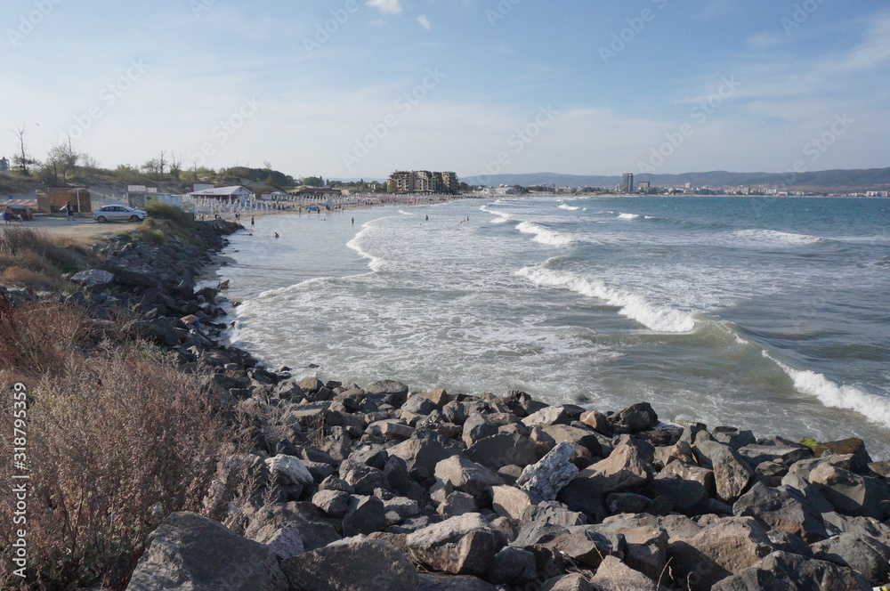 Sea waves running on stones, summer vacation.