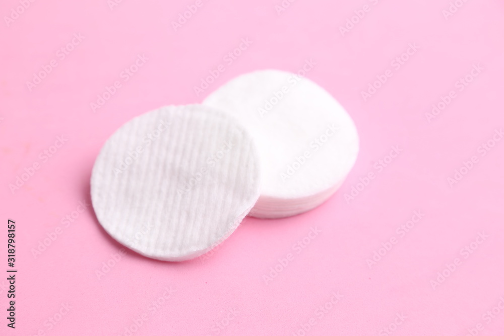 Cleansing cotton discs in colorful background Cleansing cotton discs in colorful background
