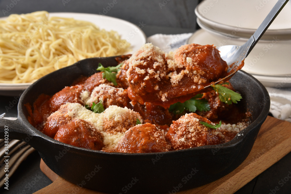 Serving spaghetti and meatballs Serving spaghetti and meatballs