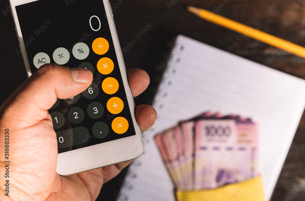 Budget, calculator, counting money, mexican pesos Stock Photo Adobe Stock