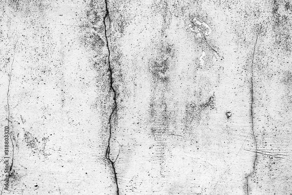 Fototapeta premium Texture of a concrete wall with cracks and scratches which can be used as a background