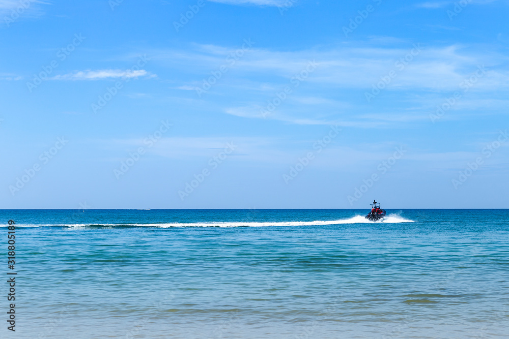 Beautiful clear blue sky and deep blue sea water with speed boat, summer outdoor day light, holiday and vacation destination