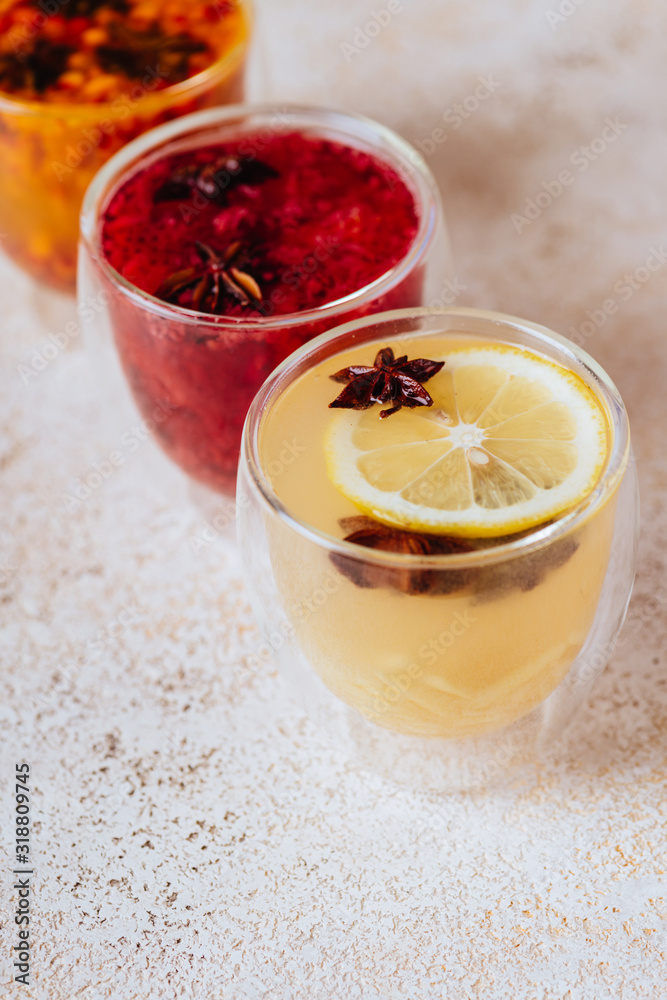 Colorfull herbal tea on a light wooden background