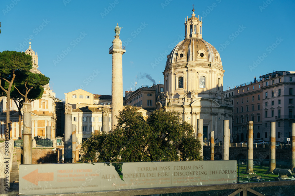 Rome, Italy - Dec 31, 2019: Trajan's Column (UNESCO World Heritage Site) in Trajan's Forum and church of Santa Maria di Loreto, Rome, Lazio, Italy