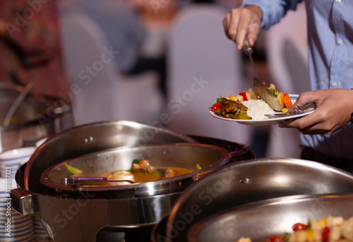 Food Buffet Catering Dining Eating Party Sharing Concept.people group catering buffet food indoor in luxury restaurant with meat colorful fruits and vegetables