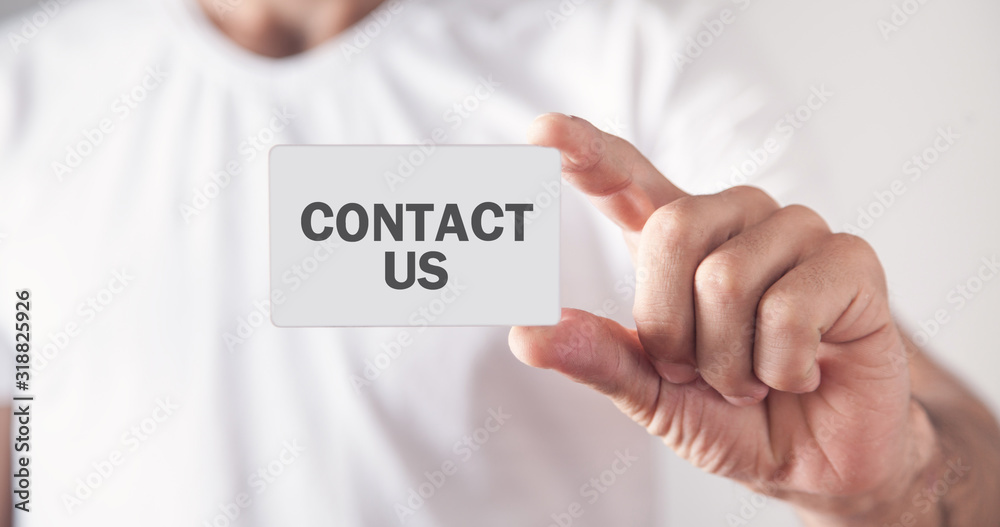 Man showing Contact Us text on business card. Man showing Contact Us text on business card.