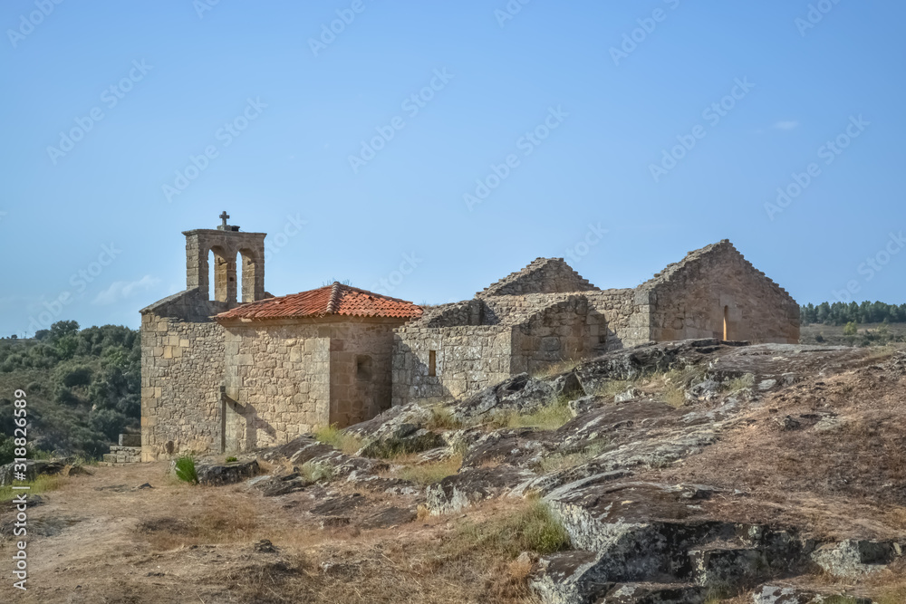View at the exterior fortress and religious church ruins, medieval village inside fortress castle of Castelo Mendo
