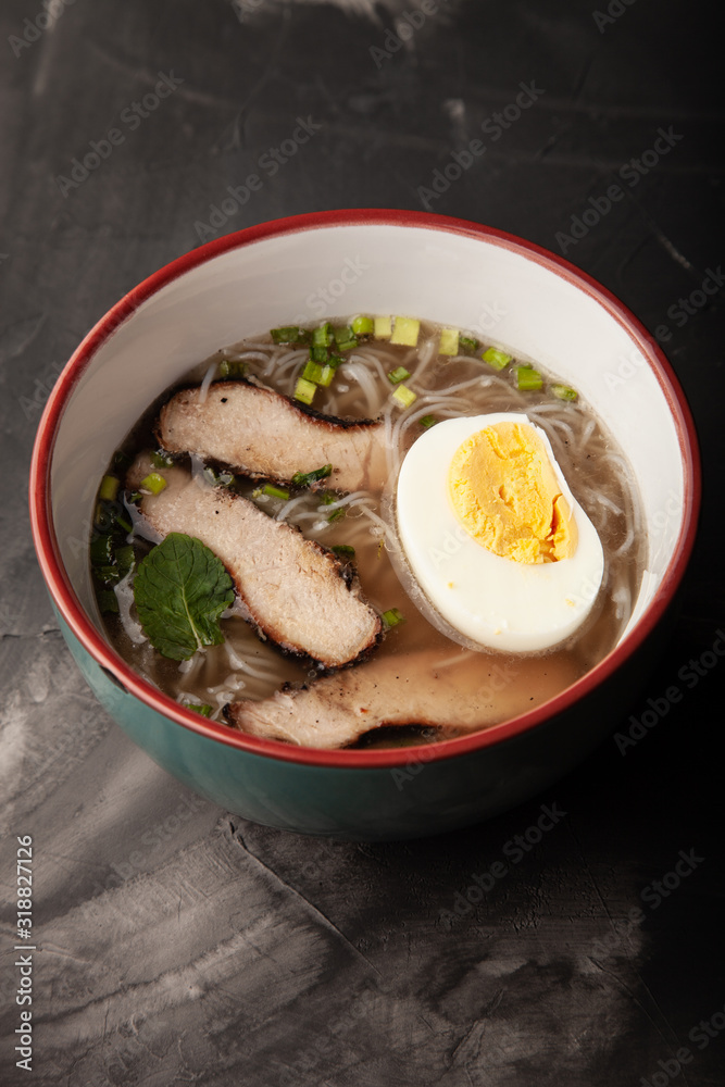 Composition with a bowl of rice noodles, meat and vegetables Composition with a bowl of rice noodles, meat and vegetables