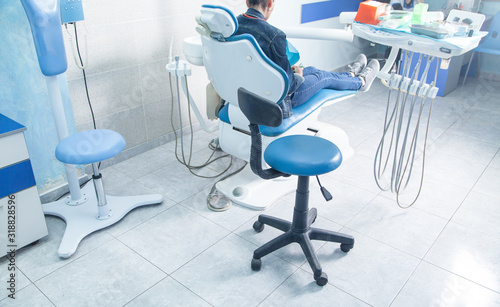 Woman sitting in a dental chair in the clinic.