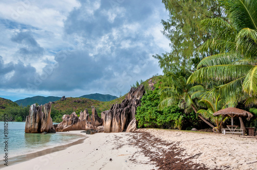 The coastline white sand beach of the island of Curieuse, Seychelles
