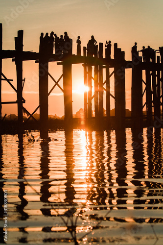 Silhouette of people walking on Bridge U-Bein at sunset scene in Amarapura  Mandalay  Myanmar