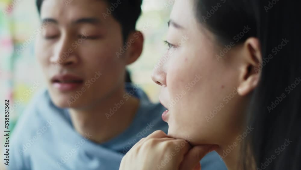 Handheld view of Vietnamese couple talking at cafe. Shot with RED helium camera in 8K Handheld view of Vietnamese couple talking at cafe. Shot with RED helium camera in 8K