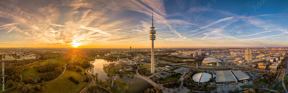 Panoramic aerial view at sunset over Munichs Olympic park. - obrazy, fototapety, plakaty 