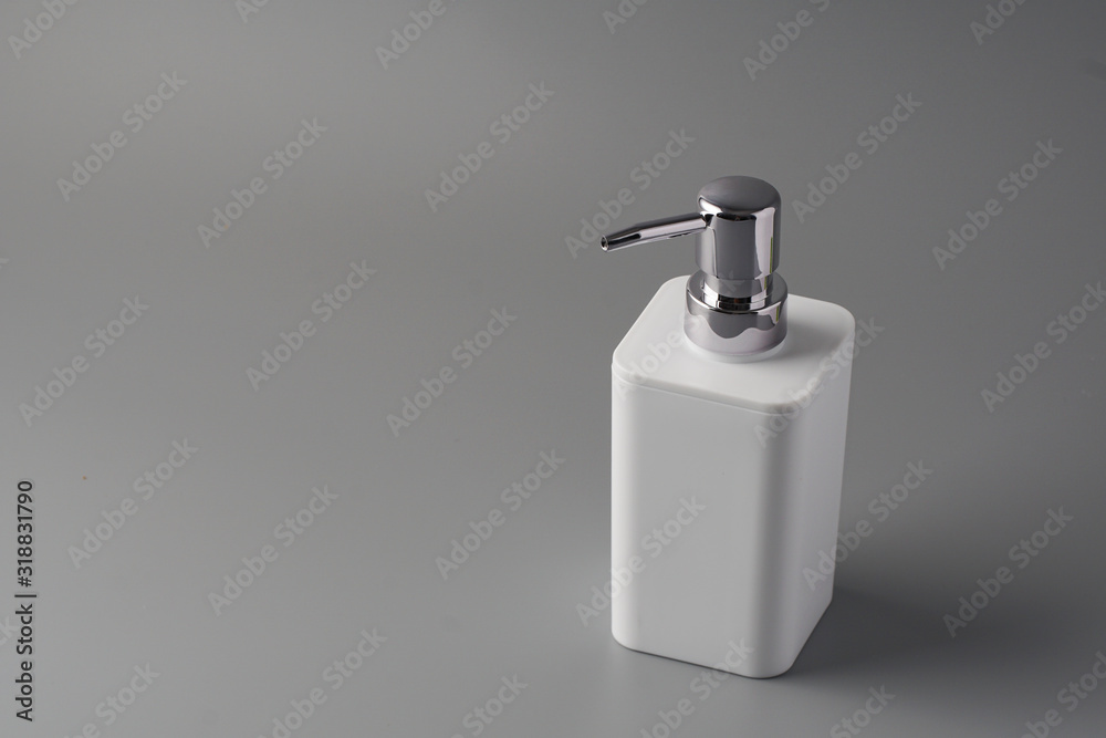 Liquid soap bottle on grey background Liquid soap bottle on grey background