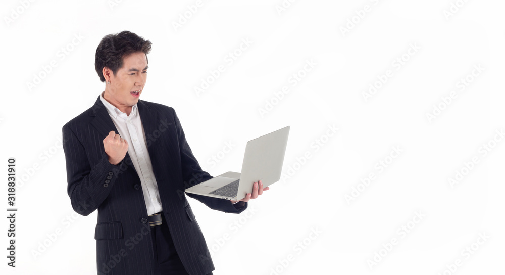Handsome Asian businessman look at computers in their hands and showing signs of being happy with a successful deal.White background and isolated Handsome Asian businessman look at computers in their hands and showing signs of being happy with a successful deal.White background and isolated