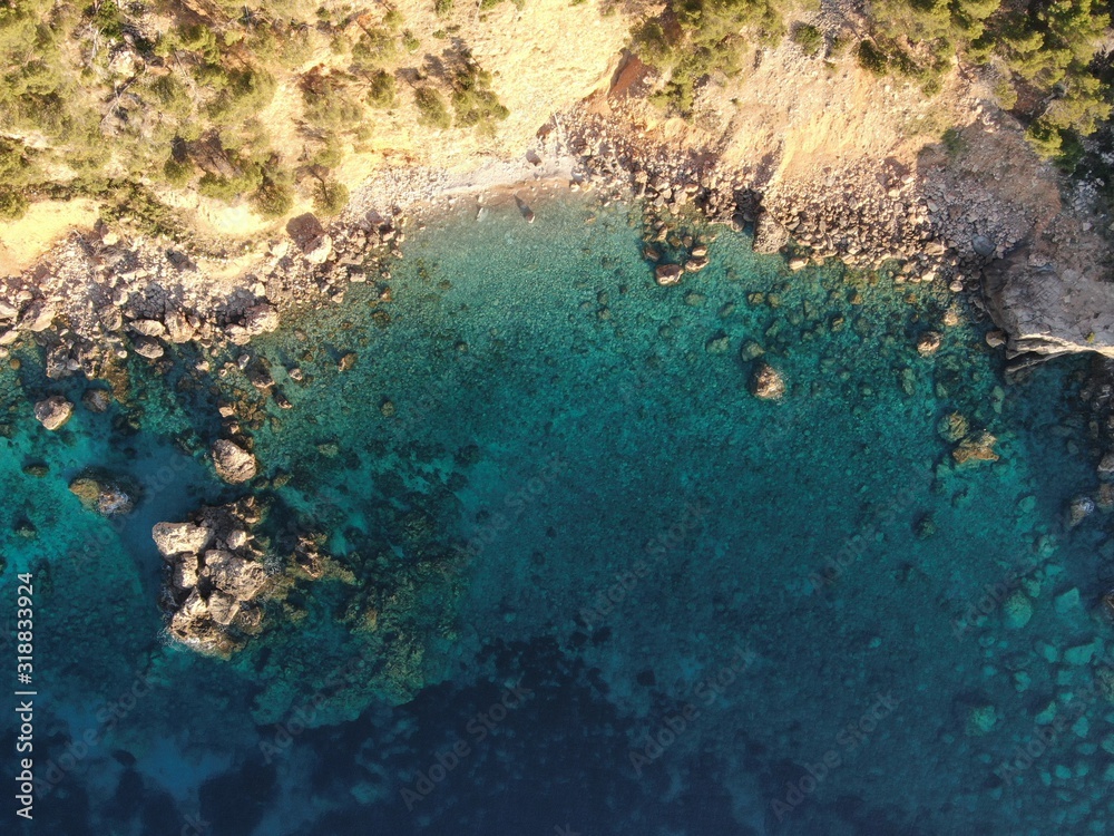 aerial view of the sea and  coast of mallorca with tourquise calm water of the island of mallorca