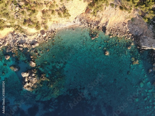 aerial view of the sea and coast of mallorca with tourquise calm water of the island of mallorca