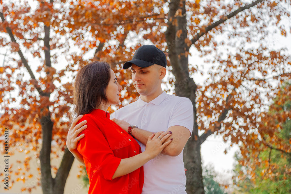Happy couple in love on a background of yellow leaves in autumn. Happy couple in love on a background of yellow leaves in autumn.