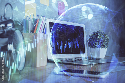 Financial graph colorful drawing and table with computer on background. Double exposure. Concept of international markets.