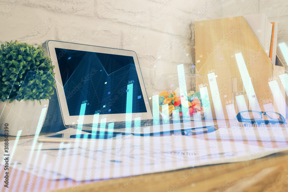 Forex market graph hologram and personal computer on background. Multi exposure. Concept of investment. Forex market graph hologram and personal computer on background. Multi exposure. Concept of investment.