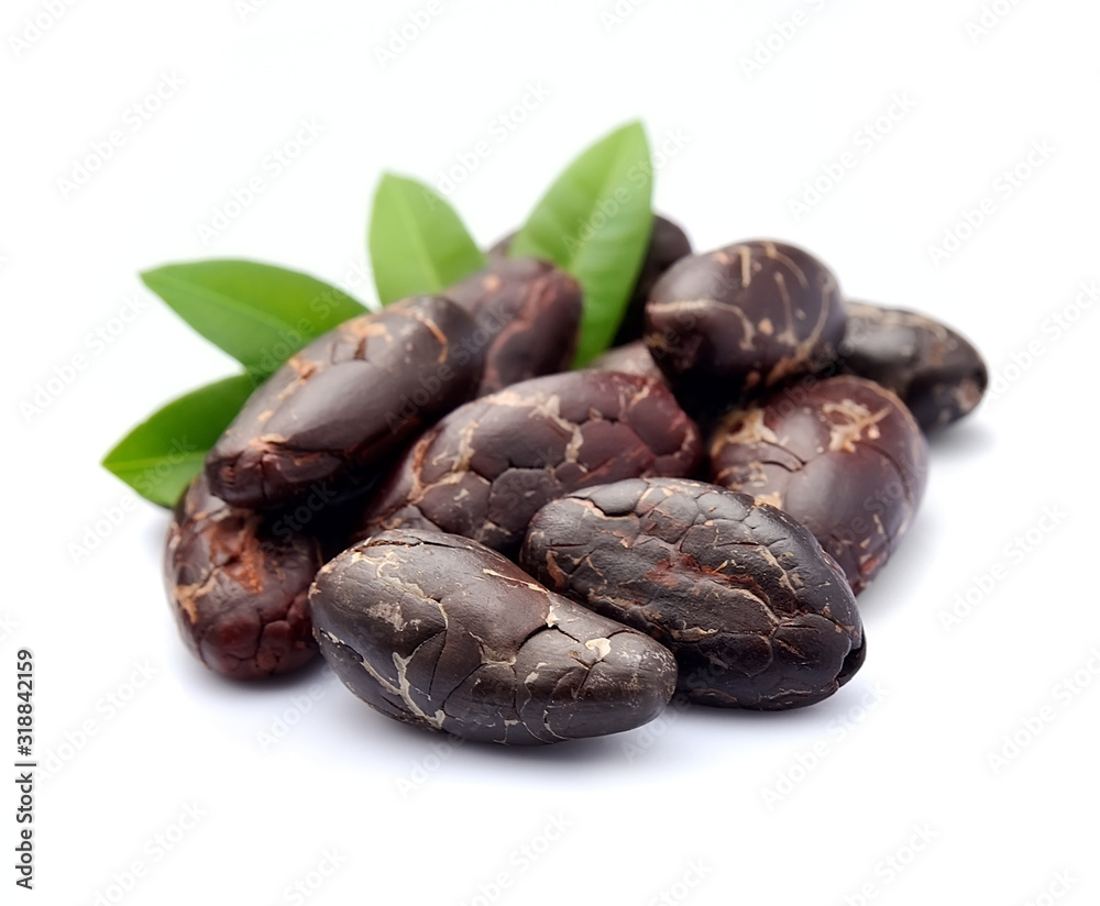 Cocoa beans with leaves . Cocoa beans with leaves .