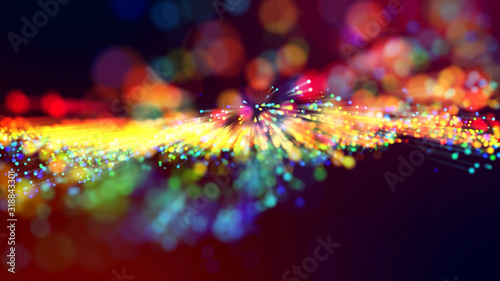 3d abstract beautiful background with light rays colorful glowing particles, depth of field, bokeh. Abstract explosion of multicolored shiny particles or light rays like laser show.