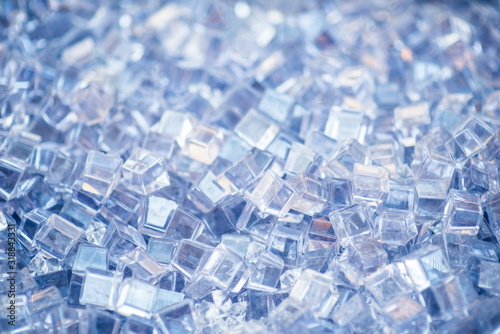 Blue and shiny ice cubes, cold background