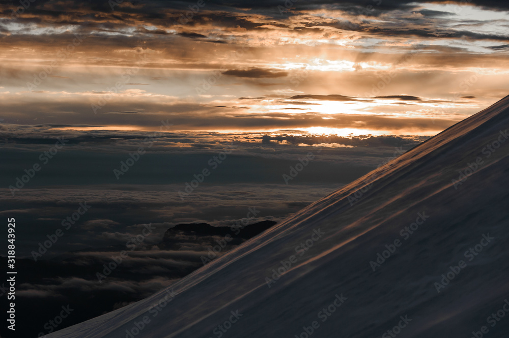 View at sunrise from angled slope of mountain
