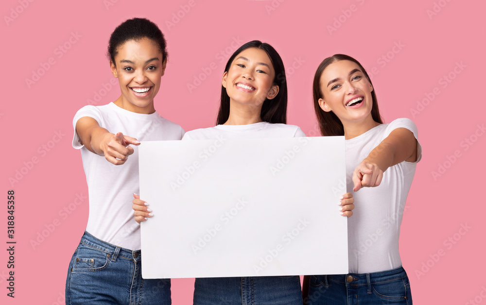Three Women Holding Blank Poster Over Pink Studio Background, Panorama Three Women Holding Blank Poster Over Pink Studio Background, Panorama