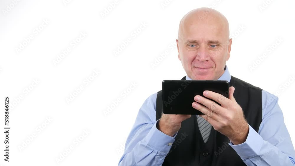 Businessman Smile and Gesticulate Happy Reading Financial Good News on Electronic Tablet Businessman Smile and Gesticulate Happy Reading Financial Good News on Electronic Tablet