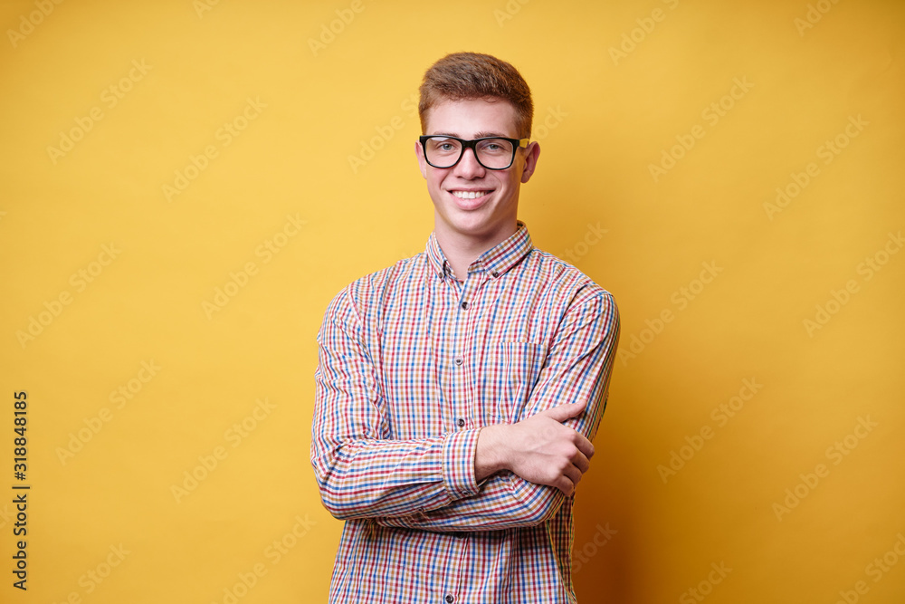 Studio portrait of happy handsome young man on yellow background. Studio portrait of happy handsome young man on yellow background.