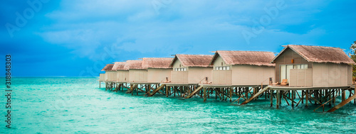 Beautiful view of water bungalow over tropical beach © Thanrada
