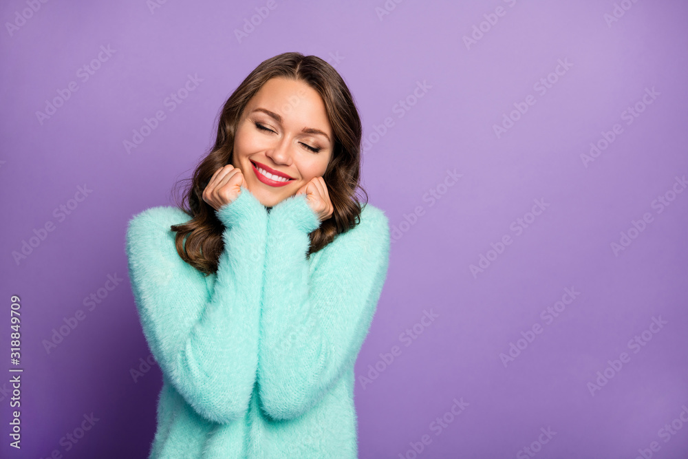 Photo of beautiful pretty lady hold arms on cheekbones eyes closed toothy smiling enjoy warmth softness of fluffy fuzzy mint pastel color sweater isolated purple color background Photo of beautiful pretty lady hold arms on cheekbones eyes closed toothy smiling enjoy warmth softness of fluffy fuzzy mint pastel color sweater isolated purple color background
