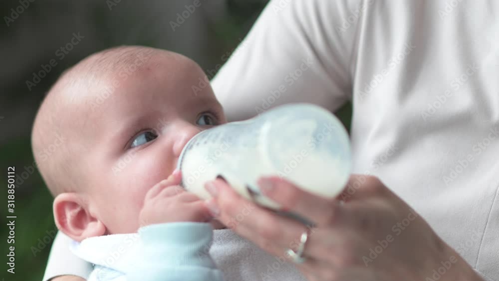 Woman feeding her baby at home Woman feeding her baby at home