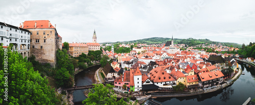 Aerial panoramic view of the typical colorful houses and landmarks of Cesky Krumlov with Vltava river at the foreground (Czech Republic)