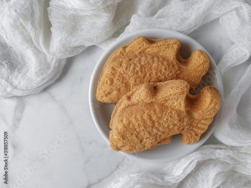 White photoshoot of baulu cakes in the form of goldfish. A malay people called kuih bahulu. photo