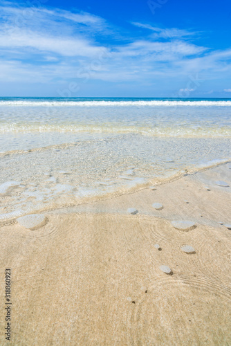 Sand and wave at the beach background