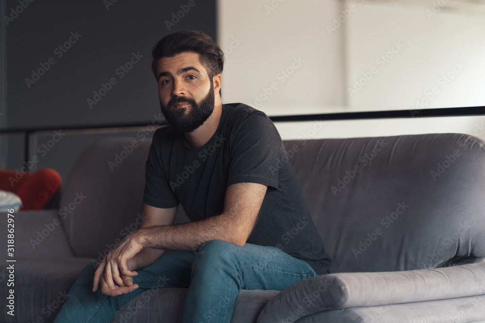 Young man sitting relaxing on the couch