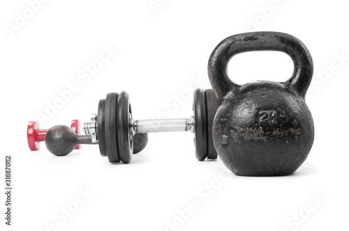 Kettlebell close up and dumbbells on white background