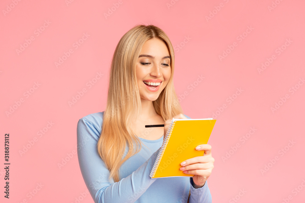 Teenager holding pen and notepad at studio Teenager holding pen and notepad at studio