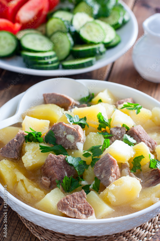 Beef stew with chopped beef in a white bowl, selective focus Beef stew with chopped beef in a white bowl, selective focus