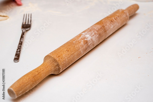 rolling pin on the table with flour