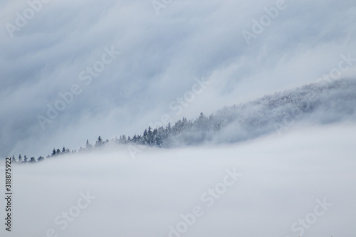 cloud inversion on mountains during winter Ješted Czeche Republic © Martin Moutayrek ©