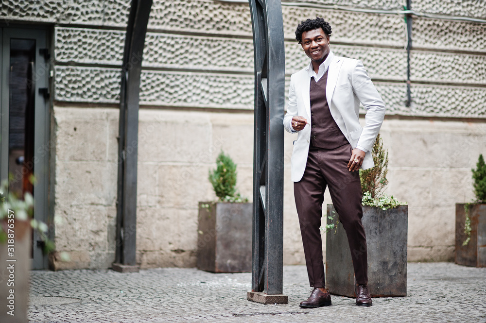 Thoughtful young handsome african american gentleman in formalwear. Black stylish model man in white jacket. Thoughtful young handsome african american gentleman in formalwear. Black stylish model man in white jacket.