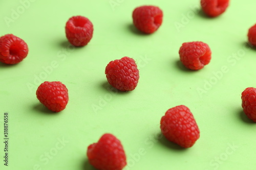 delicious raspberries in colorful background