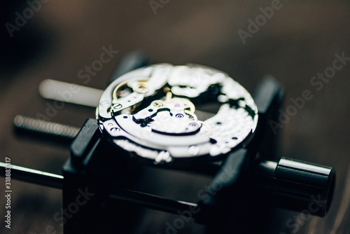 Close up view of open mechanical wristwatch on movement holder