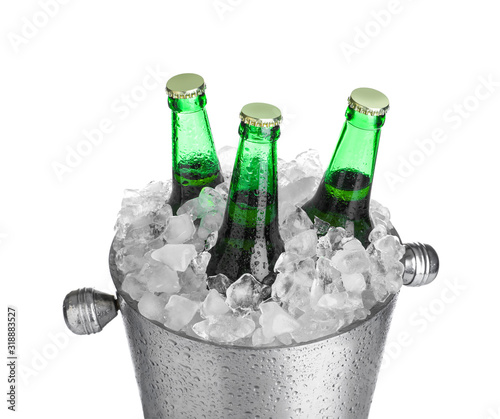 Beer in metal bucket with ice isolated on white