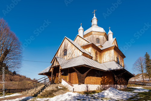 Fototapeta Naklejka Na Ścianę i Meble - Exterior of Hoszow Wooden Orthodox Church.  Bieszczady Architecture in Winter. Carpathia Region in Poland