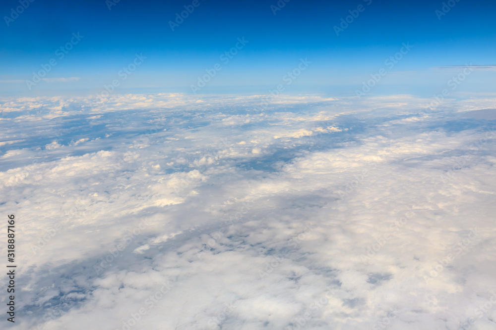 High blue sky and various shapes of white clouds
