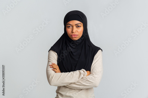 Sceptical african american teen looking suspiciously to camera, having some doubts, copy space